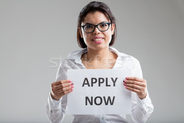 smiling woman with an apply-now sign Stock photo © Giulio_Fornasar