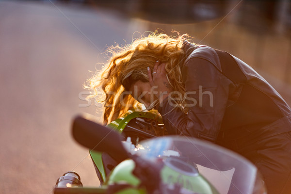 woman setting up her motorcycle to run Stock photo © Giulio_Fornasar