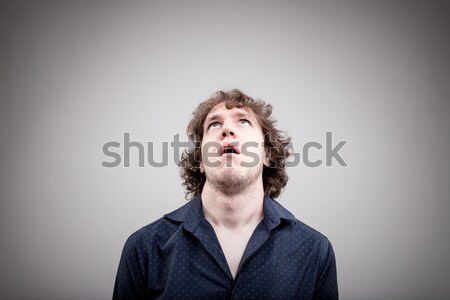 Porträt jungen gelangweilt Mann Suche Barmherzigkeit Stock foto © Giulio_Fornasar