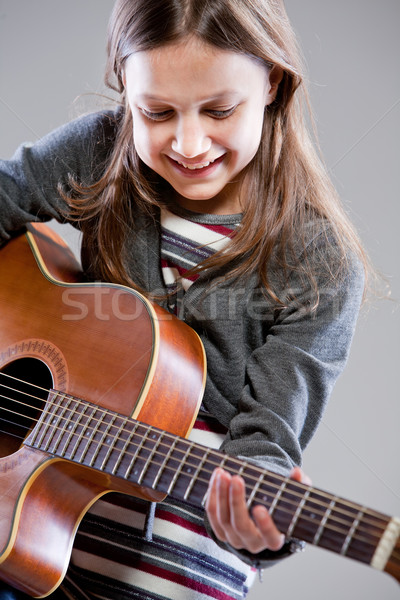 little girl playing acoustic guitar Stock photo © Giulio_Fornasar