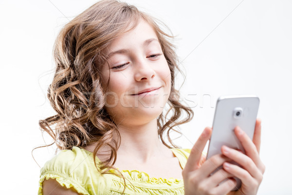 Kleines Mädchen zufrieden Handy Mädchen Status Stock foto © Giulio_Fornasar