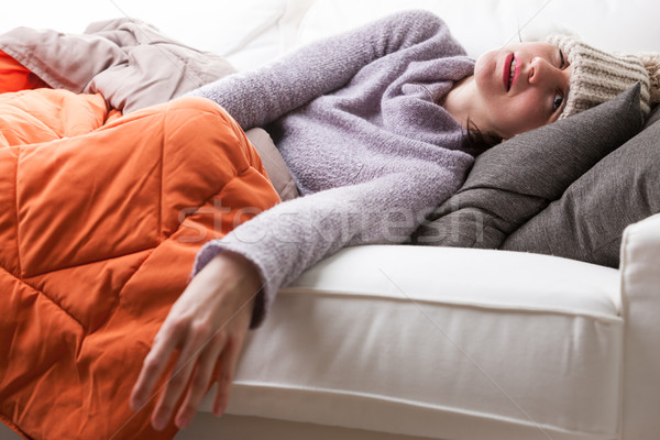 Mulher sofá gripe sofá pose forte Foto stock © Giulio_Fornasar