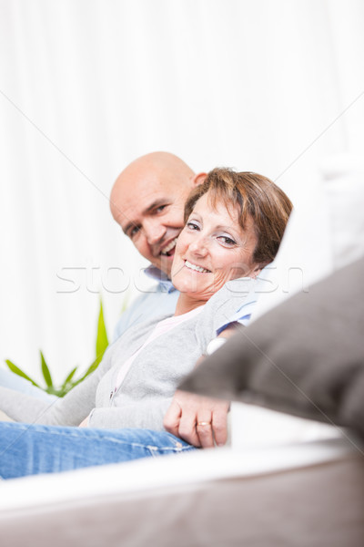 Relaxed pretty woman turning to smile at the lens Stock photo © Giulio_Fornasar