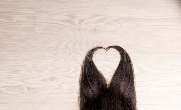 Stock photo: hair in shape of heart on wood