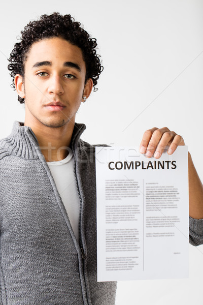 young man holding complaints report Stock photo © Giulio_Fornasar