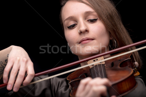 violinist woman with a nose piercing playing Stock photo © Giulio_Fornasar