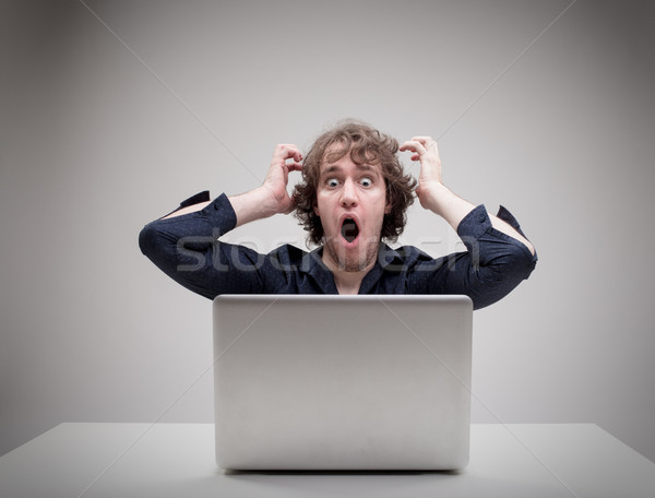 Megrémült férfi számítógép üzletember valami olvas Stock fotó © Giulio_Fornasar