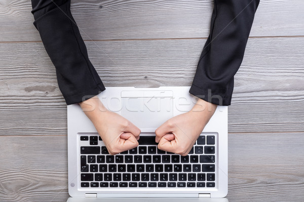 Above view of clenched fists hitting keyboard Stock photo © Giulio_Fornasar