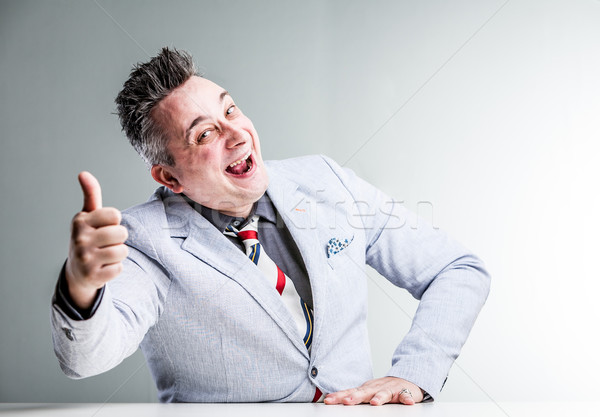 Stock photo: sales con artist showing thumb up