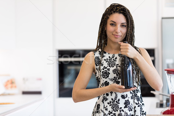 Pretty woman with bottle of vine Stock photo © Giulio_Fornasar