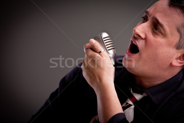 fifties style singer on a dark background Stock photo © Giulio_Fornasar