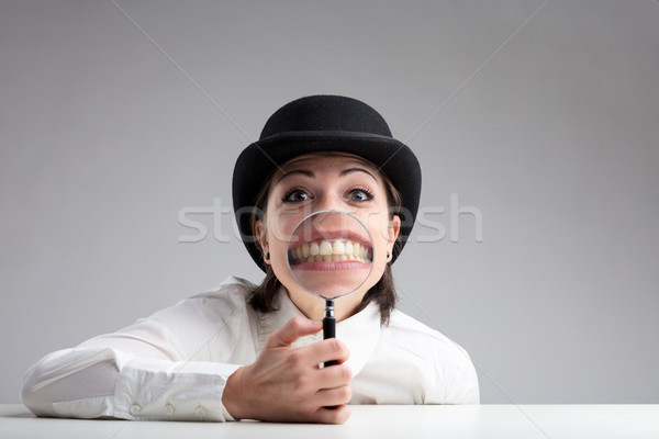 teeth behind a magnifier and a funny face Stock photo © Giulio_Fornasar