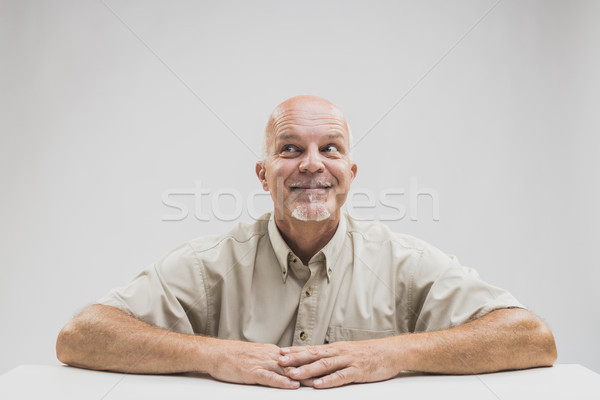 Senior man kijken tabel Stockfoto © Giulio_Fornasar