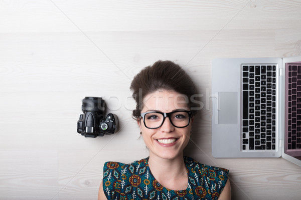 smiling woman is a photographer and graphic designer Stock photo © Giulio_Fornasar