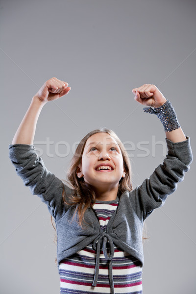 little girl exulting raising her arms Stock photo © Giulio_Fornasar