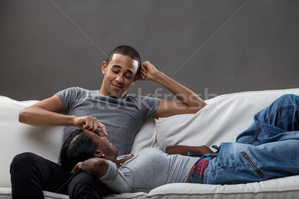 Stock photo: young man and a woman using mobile phones