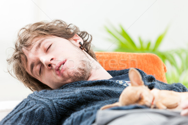 Young man sleeping with his dog on his chest Stock photo © Giulio_Fornasar