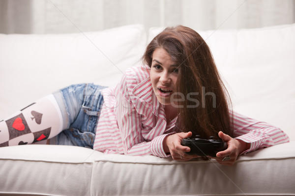 pretty girl playing videogames at home Stock photo © Giulio_Fornasar