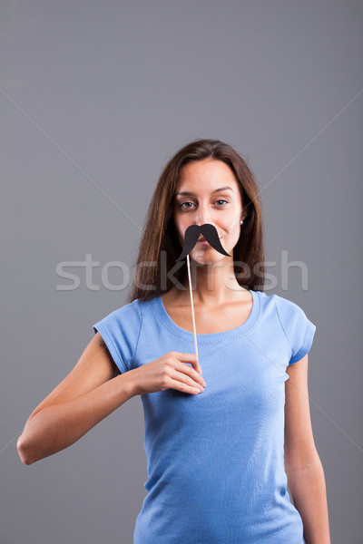 fake carton moustaches on a pretty girl Stock photo © Giulio_Fornasar