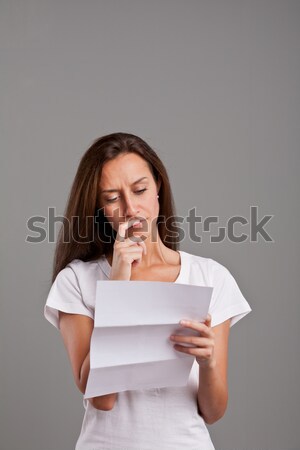 Lány olvas bizonytalan hírek barna hajú fehér Stock fotó © Giulio_Fornasar