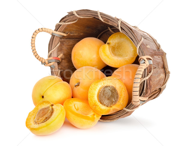 Ripe apricots in a wooden basket Stock photo © Givaga