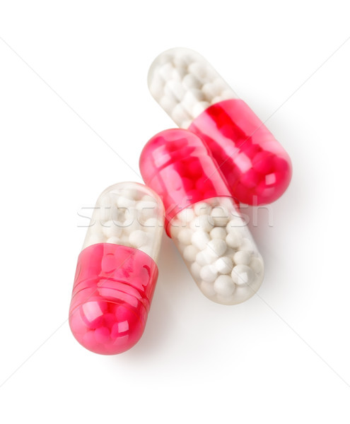 Três vermelho cápsulas isolado branco medicina Foto stock © Givaga