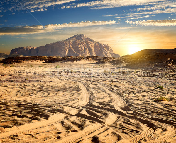 Rotsen woestijn zand zonnige avond hemel Stockfoto © Givaga