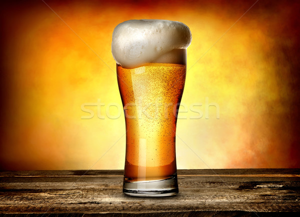Schuim bier glas houten tafel textuur licht Stockfoto © Givaga