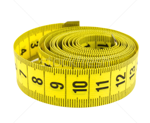 Curled yellow measuring tape Stock photo © Givaga