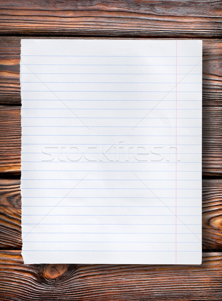 Lined paper on dark table Stock photo © Givaga