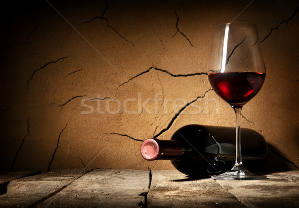 Wine and cracked wall Stock photo © Givaga