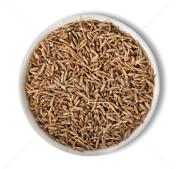 Cumin in plate isolated Stock photo © Givaga