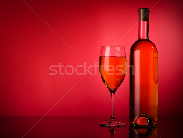 White wine on a red background Stock photo © Givaga