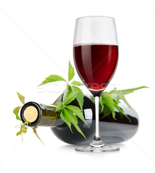 Stock photo: Wineglass and wine bottle with vine