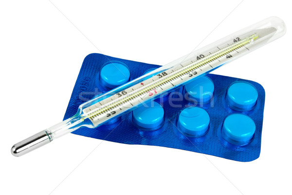 Thermometer with pills isolated Stock photo © Givaga