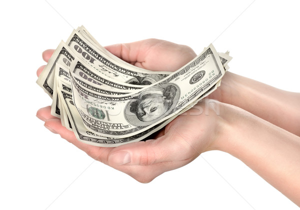 Hand holds hundreds of dollars Stock photo © Givaga