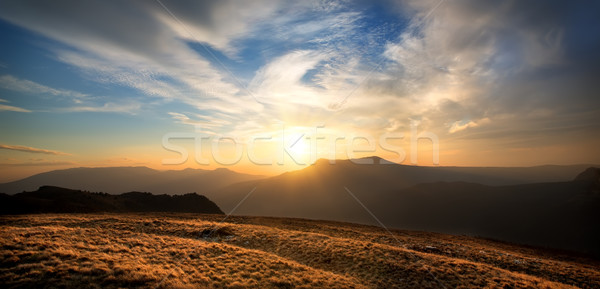 Sunset over the mountain Stock photo © Givaga