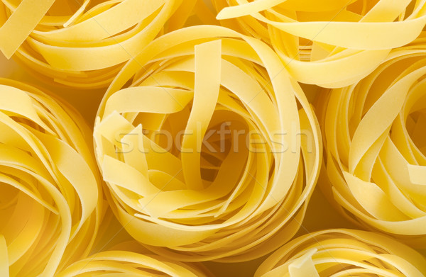 Pasta tagliatelle foto amarillo crudo patrón Foto stock © Givaga