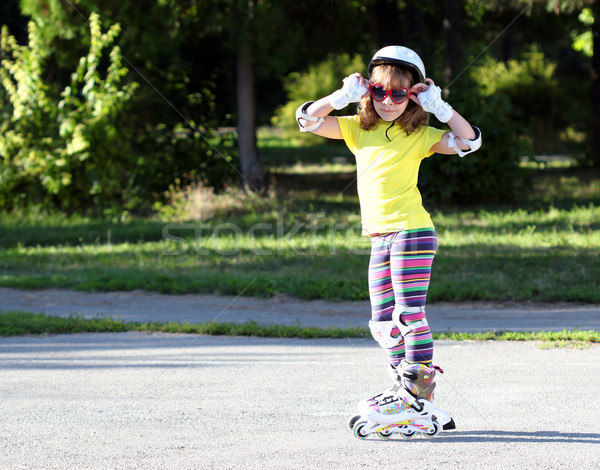 little girl with roller skates and sunglasses Stock photo © goce