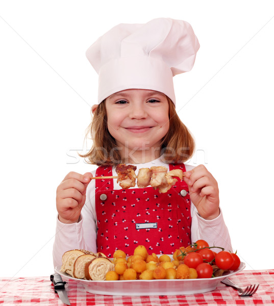 Meisje kok eten gegrilde kip vlees kinderen Stockfoto © goce