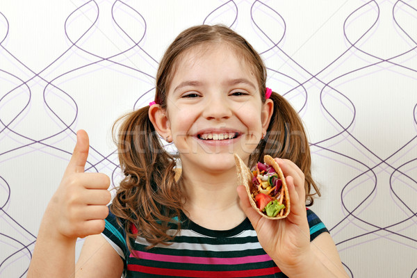 happy little girl with tacos and thumb up Stock photo © goce