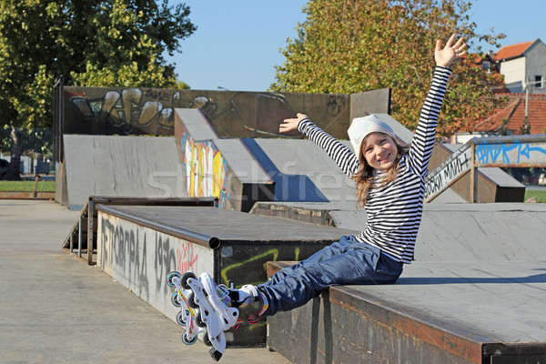 happy little girl with rollerskates fun on playground Stock photo © goce