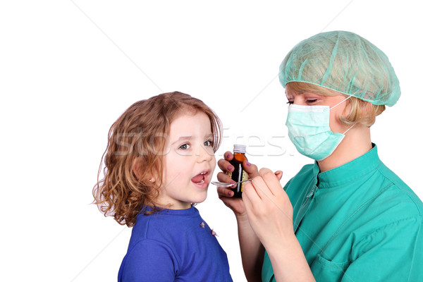 female doctor gives a little girl a cure Stock photo © goce