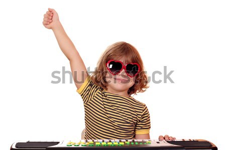 happy child play music on keyboard Stock photo © goce