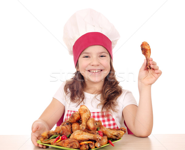 beautiful little girl cook with chicken drumstick Stock photo © goce
