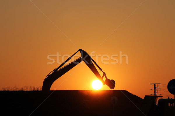 Graafmachine bouwplaats silhouet hemel zon werk Stockfoto © goce