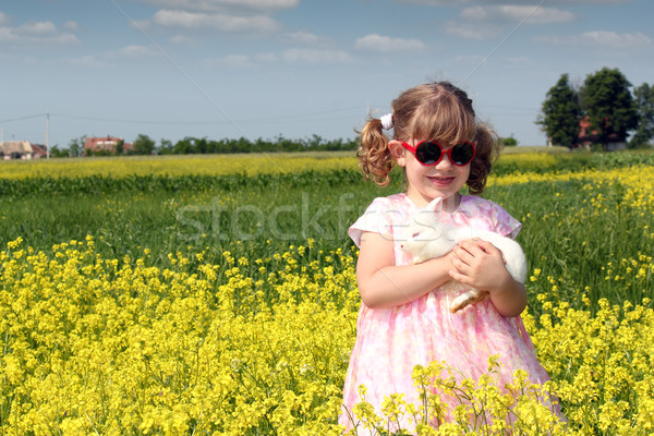 little girl with dwarf white bunny spring scene Stock photo © goce