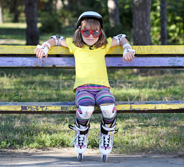 little girl with sunglasses and roller skates Stock photo © goce