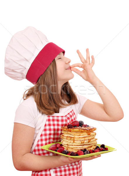 Foto stock: Little · girl · cozinhar · panquecas · sinal · da · mão · menina