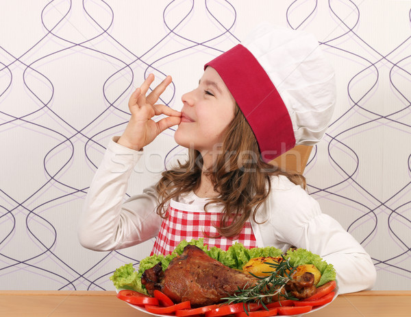 little girl cook with turkey drumstick Stock photo © goce